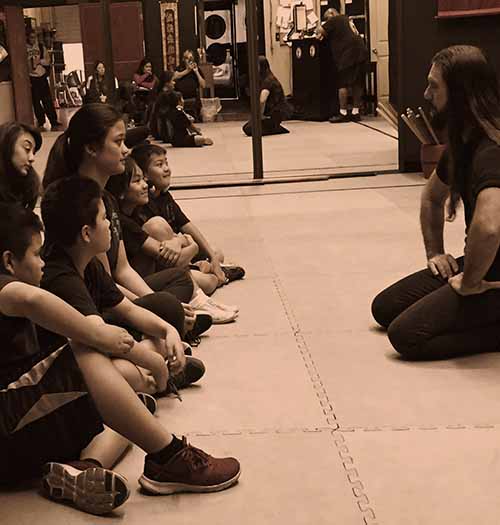 Sifu Bryan Talbot talking with his students.