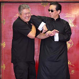 Sifu Kwok being playful with Sifu Choi.